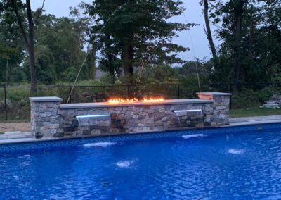 Rock wall with lighted water sheers, fire wall and deck jets
